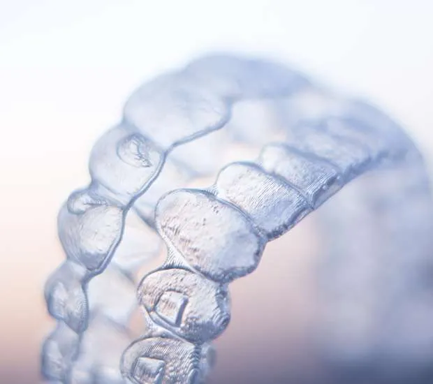 Close-up of clear orthodontic aligners.